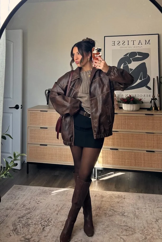Brown Leather Jacket with Gray Sweater and Black Mini Skirt