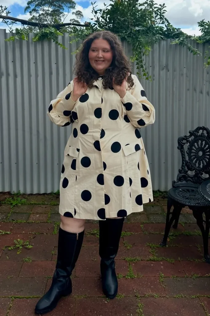12. Cream Polka Dot Coat Dress with Black Knee-High Boots