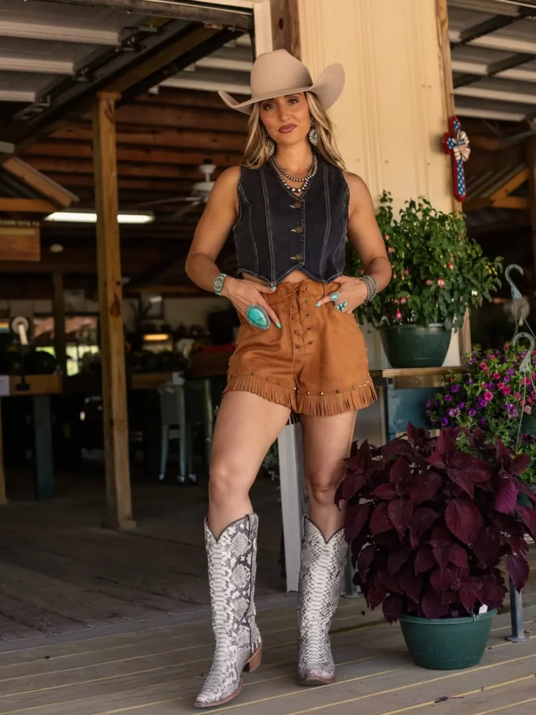 Dark Denim Vest with Tan Fringe Shorts and Snakeskin Boots