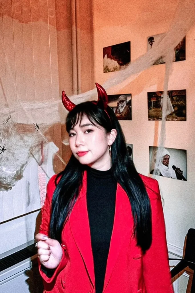 13. Red Blazer with Black Turtleneck and Red Devil Horns
