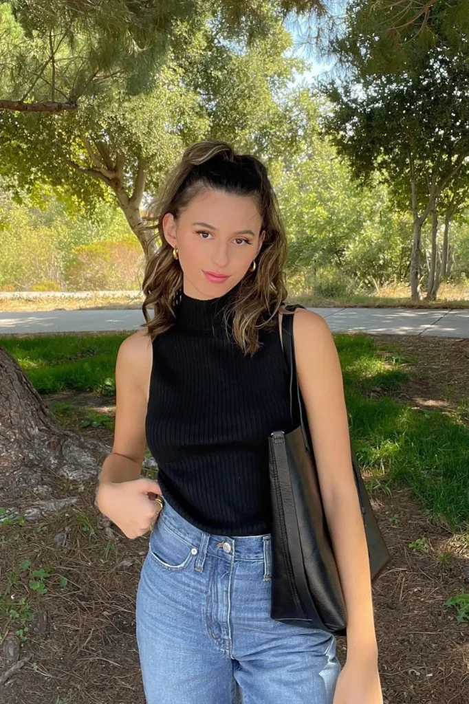 Black Sleeveless Turtleneck with Light-Wash Jeans