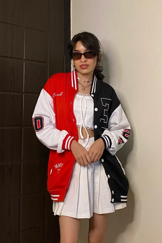 Red Varsity Jacket with White Crop Top and Pleated Mini Skirt