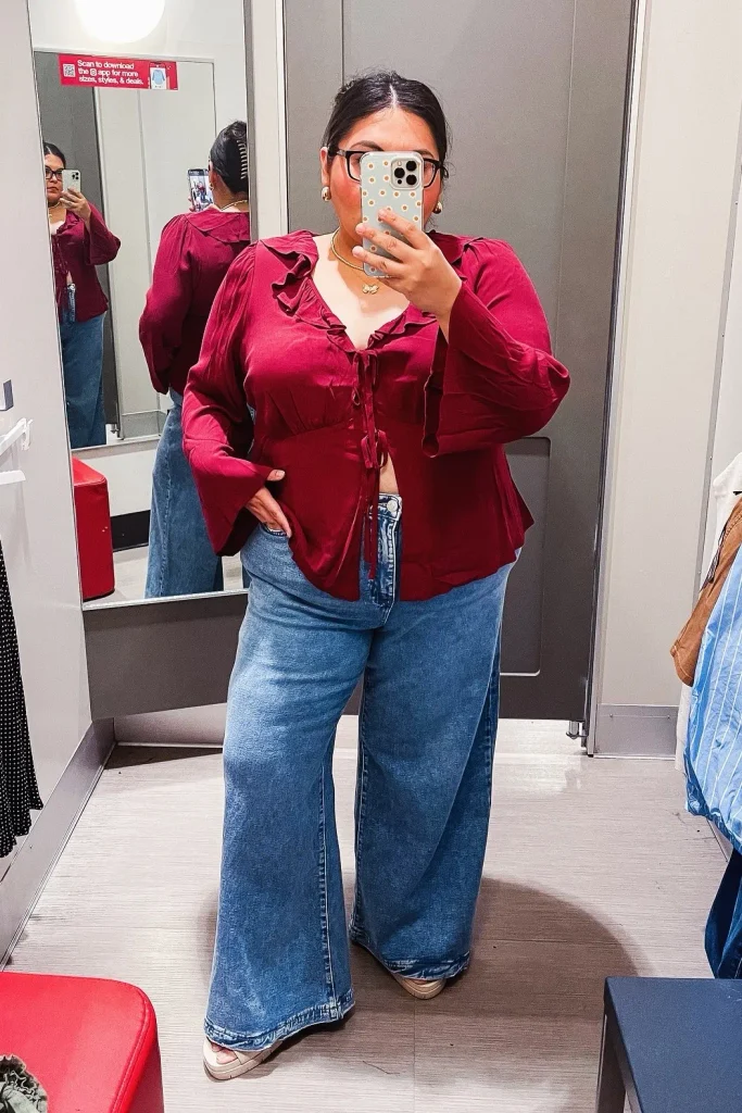 6. Burgundy Ruffle Blouse with Wide-Leg Blue Jeans