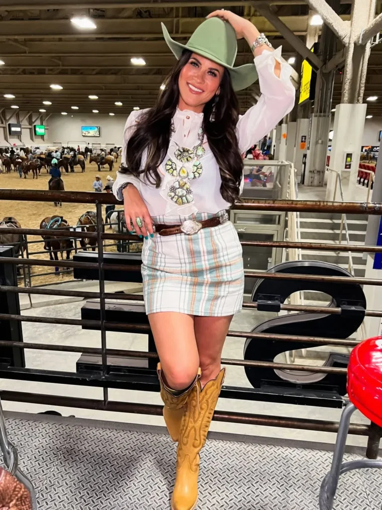 White Ruffle Blouse with a Plaid Mini Skirt and Tan Boots